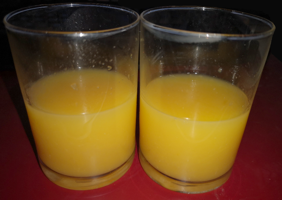 Orange Juice in two small glasses